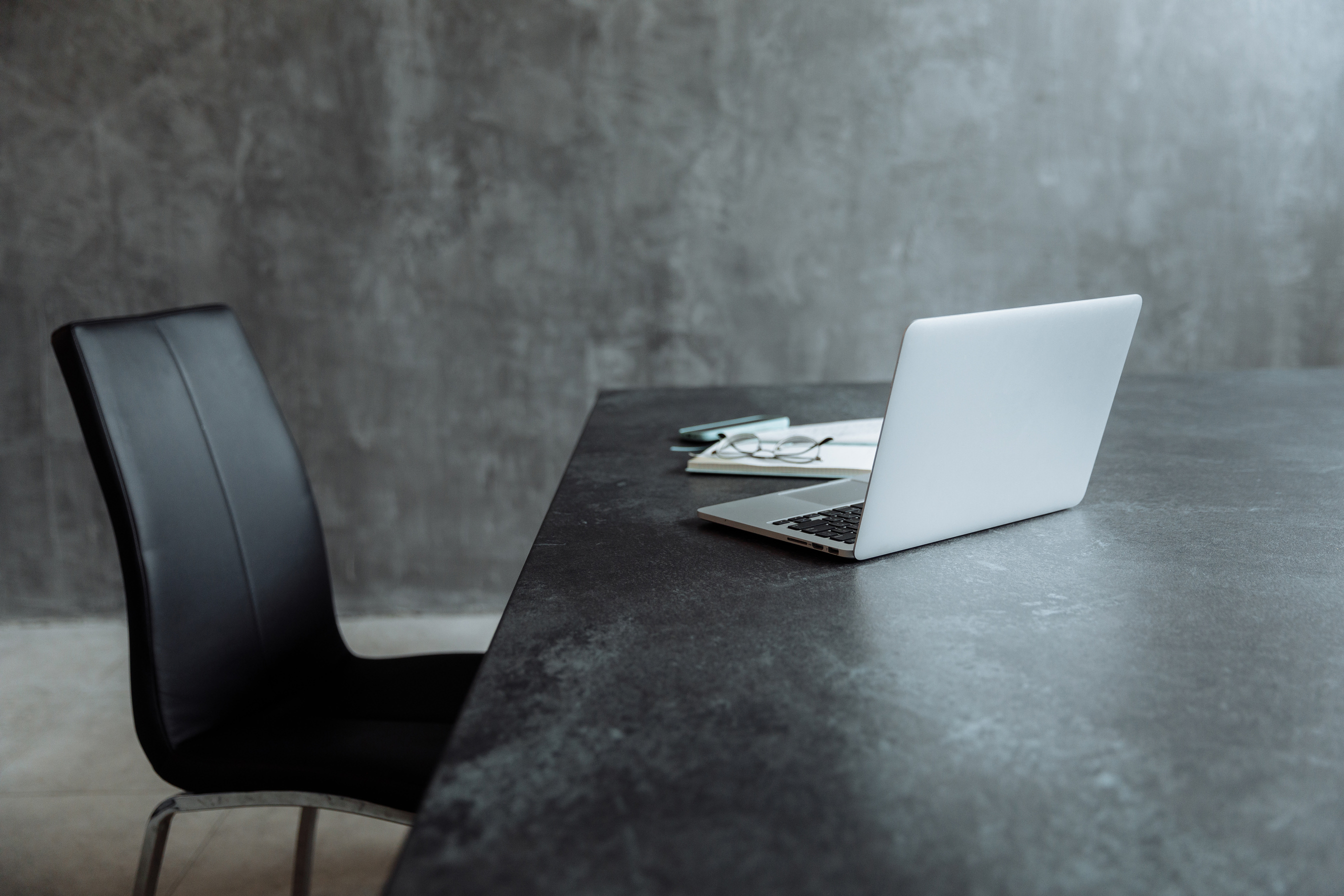 A Laptop on a Black Table